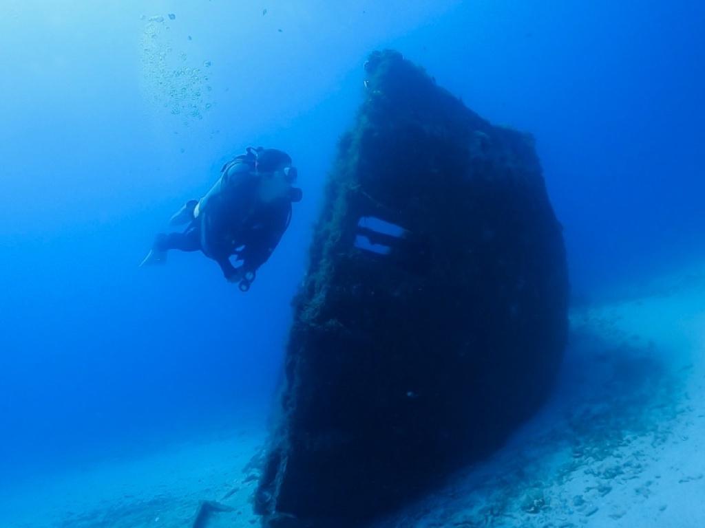 Explore a sunken ship with an underwater scooter