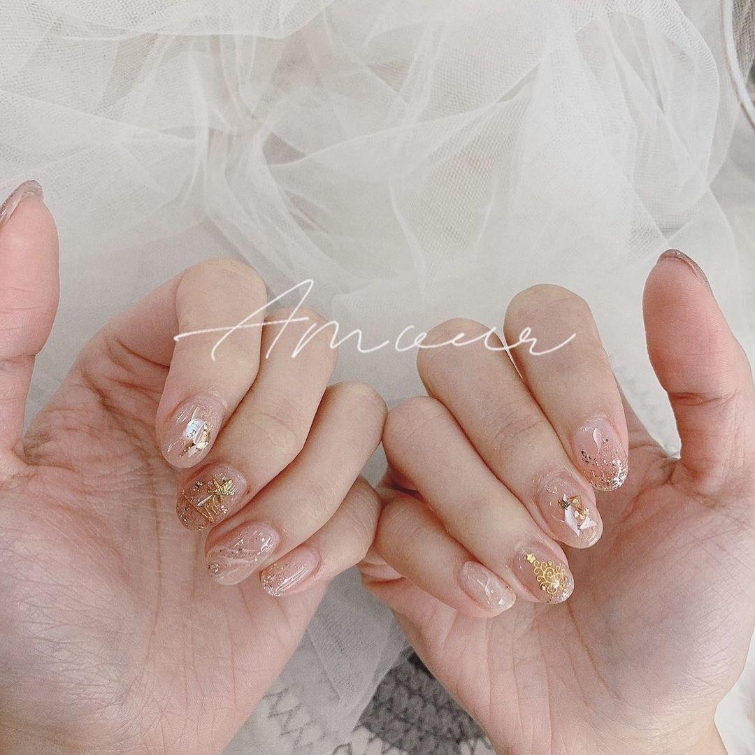 To channel your inner K-drama heroine, choose elegant, ethereal nail colors that