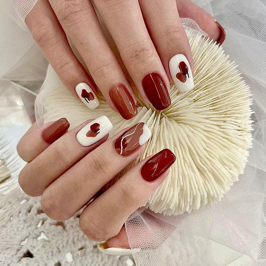 If you prefer darker nail colors, consider deep reds, purples, or coffee tones.