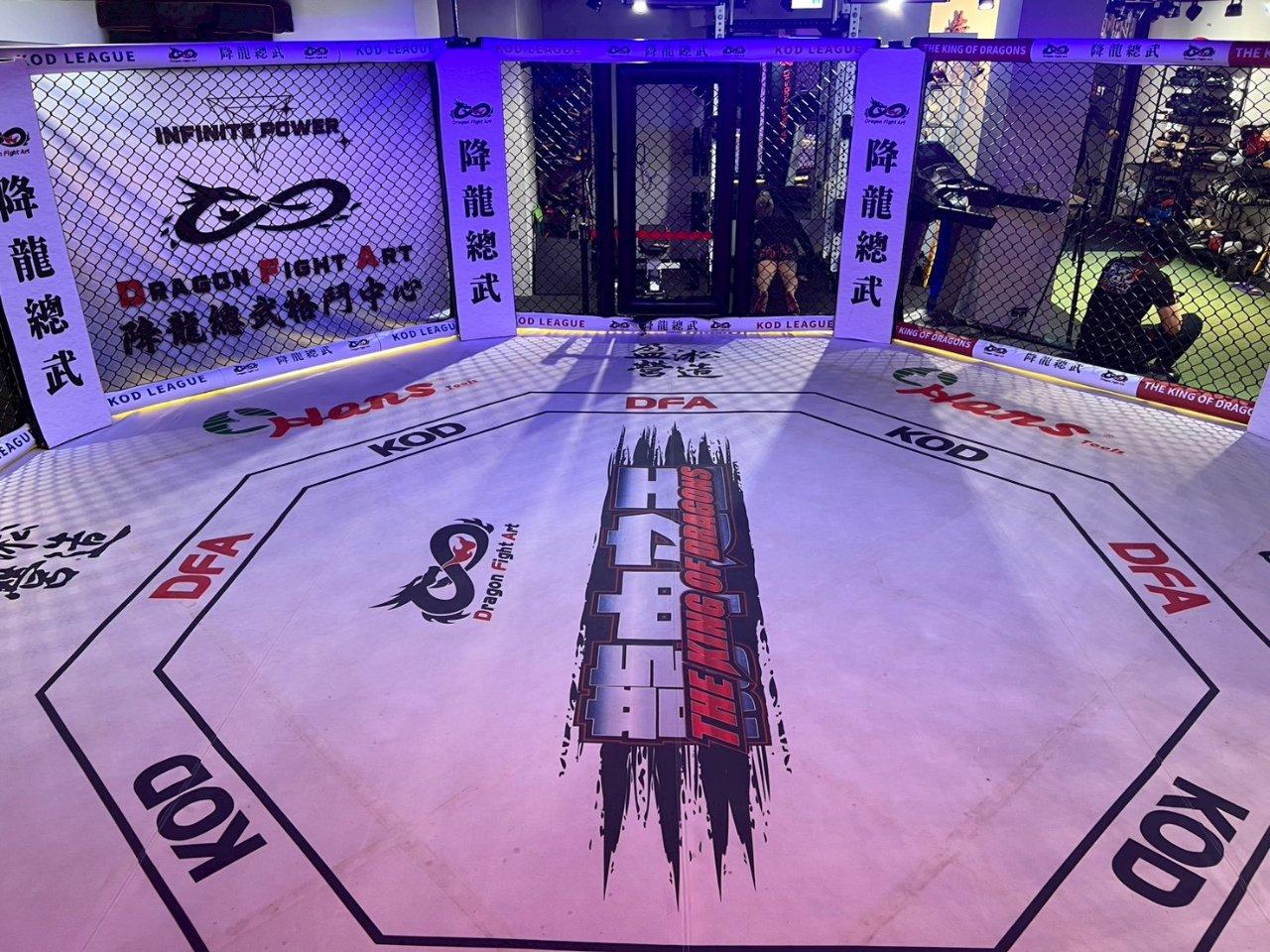 The training space is fully partitioned, with an octagon cage and punching bag area all in one place.