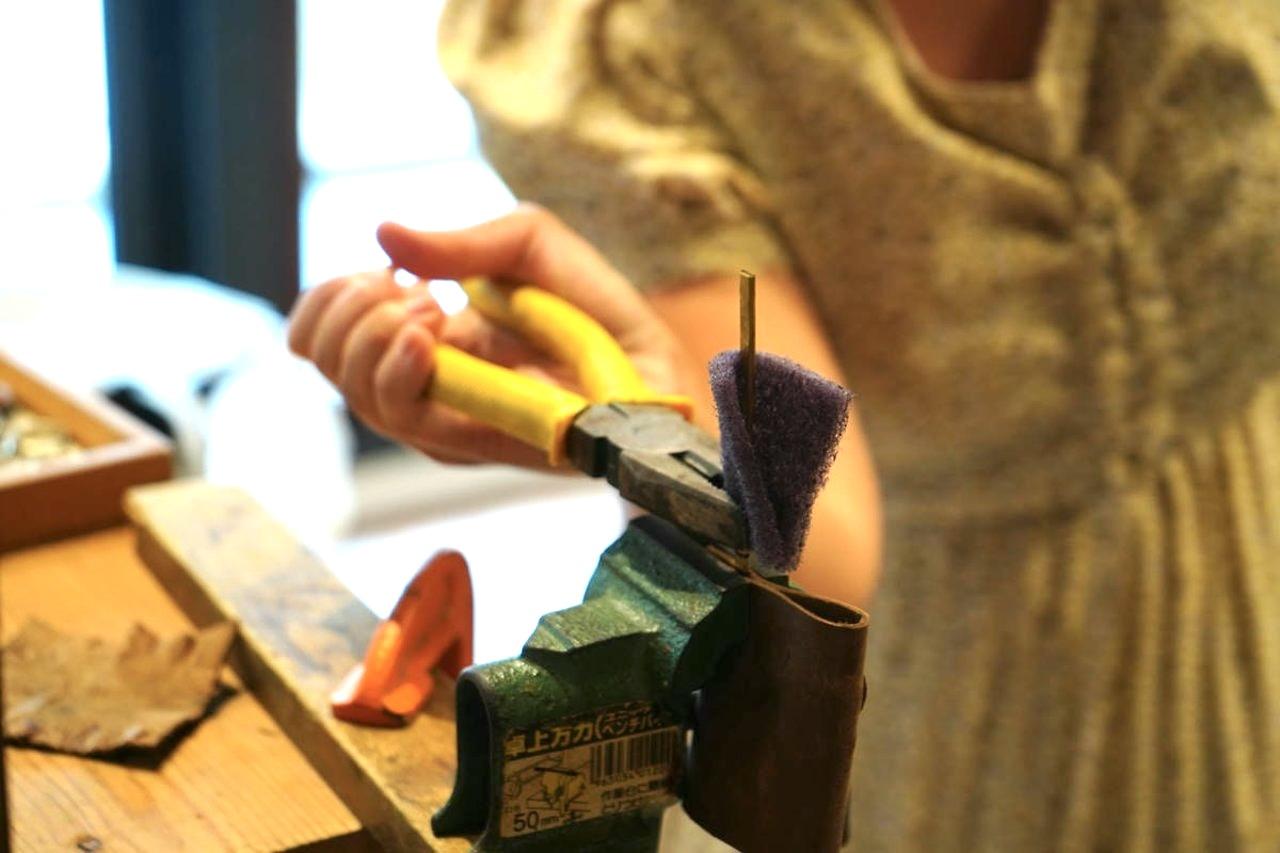 Watch a piece of copper slowly transform into an everyday accessory, from bending and filing to polishing.