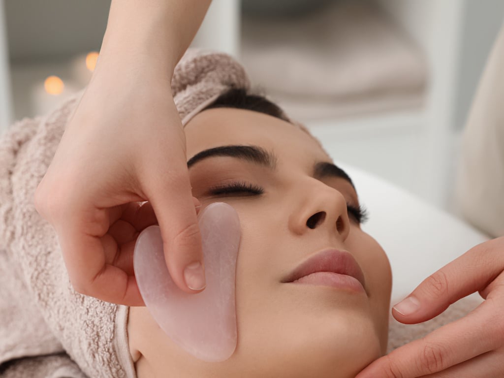 Facial rollers and gua sha tools are classic choices for a slimmer-looking face,